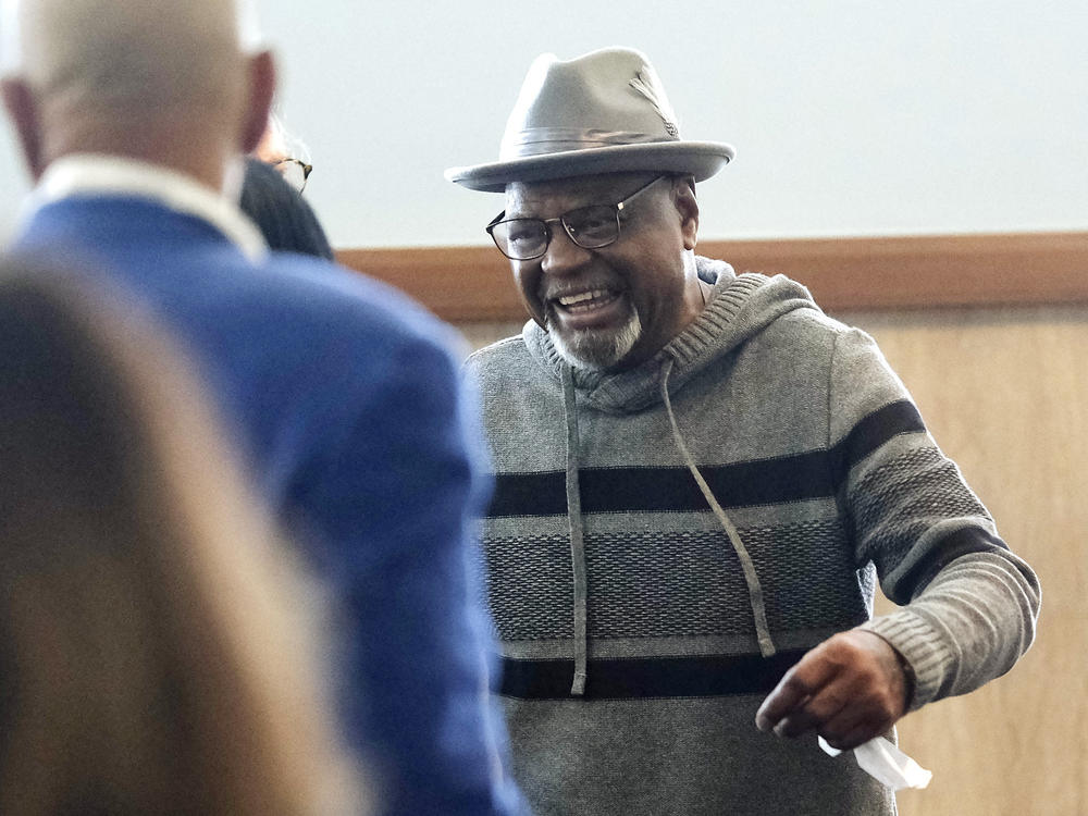 Glynn Simmons reacts as he leaves court after a judge ruled to approve his 