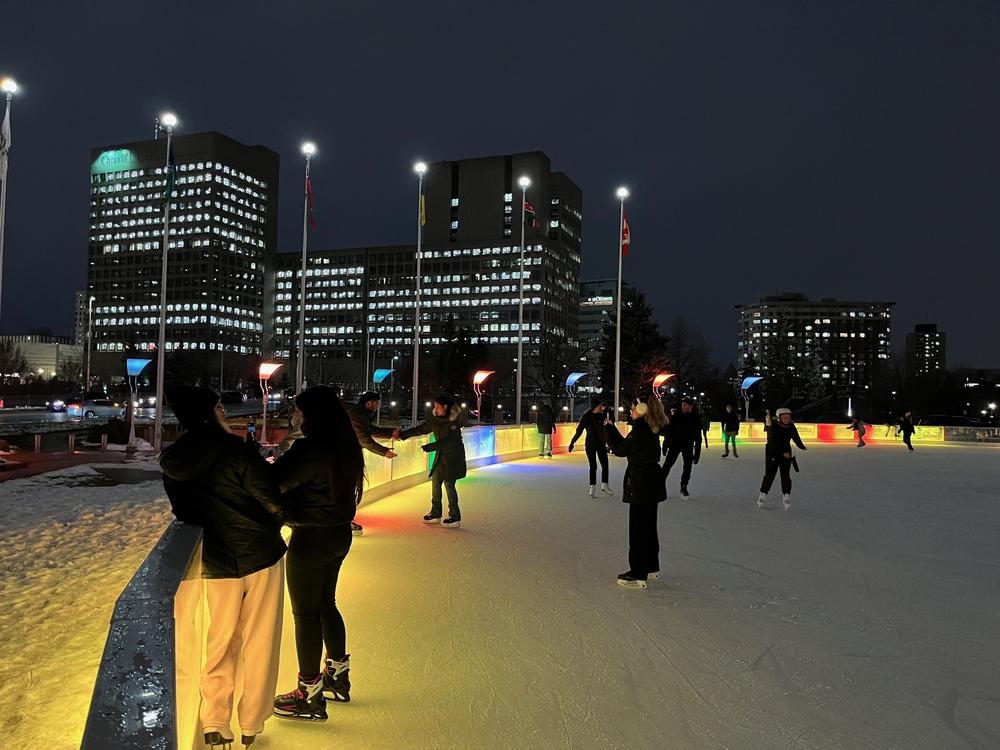 Ice skaters in front of Ottawa City Hall in Ontario on Dec. 12, 2023.