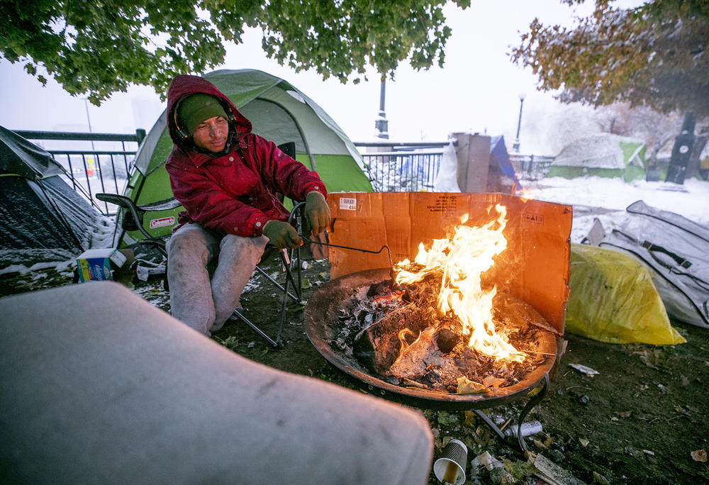 Arturo, from Venezuela, is one of the many migrants who arrived in Denver from the southern border. He stays in a tent on Zuni Street, where migrants who had stayed in a city-contracted motel relocated after they had to leave the facility in November. Full story <a href=
