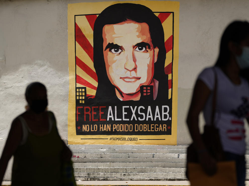 A poster in Caracas, Venezuela supporting Alex Saab — arrested on a U.S. warrant for money laundering — in a 2021 file photo. President Biden has granted clemency to Saab in a prisoner swap deal.
