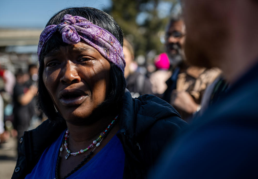 Wood Street resident Mayana Sparks cries while watching the city of Oakland begin to evict an encampment on April 10, 2023. Full story <a href=