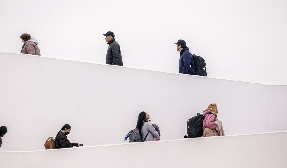 Migrants and asylum-seekers cross into the United States from Tijuana, Mexico, through the El Chaparral crossing, walking up its iconic white ramp on their way to make their asylum claim on May 12, 2023. Full story <a href=