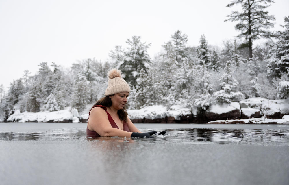 Tanya Talamante pauses in the icy water at Oakledge Park on Jan. 20, 2023, in Burlington, Vt. This is part of Vermont Public's first-person stories on how Latinos spending time outdoors can inspire deeper connections with others, their heritage and nature itself. Full story <a href=