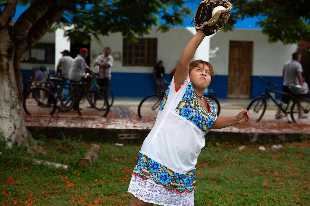 Damari Yasuri Balam Canul, 24, a player of The Amazonas of Yaxunah, catching the ball during practice at the local field in Yaxunah, Yucatán, Mexico on June 26, 2023.