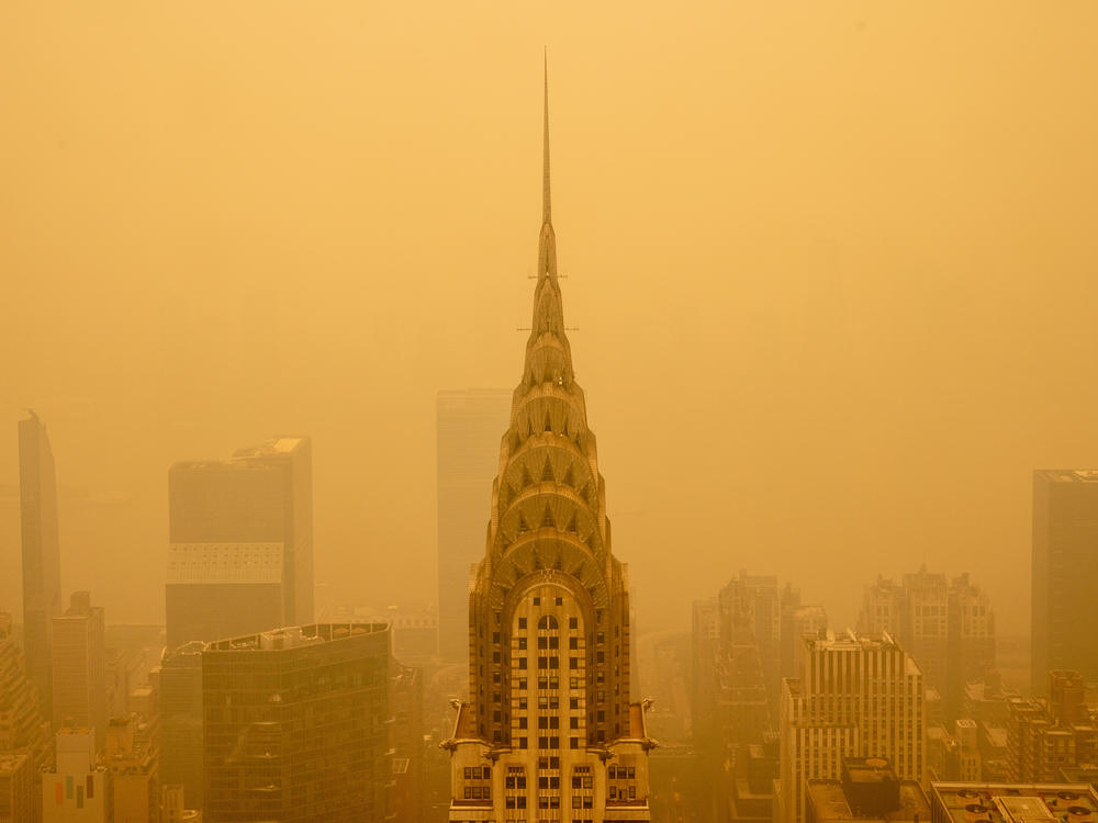 Smoke from wildfires turned the skies orange behind New York's Chrysler Building in June 2023. The smoke affected millions across the central and eastern U.S.
