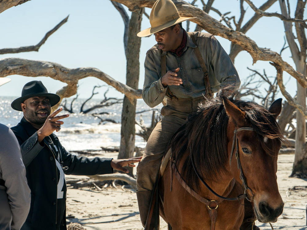 (L-R) Director Blitz Bazawule and Colman Domingo on the set of <em>The Color Purple</em>, a Warner Bros. Pictures release.