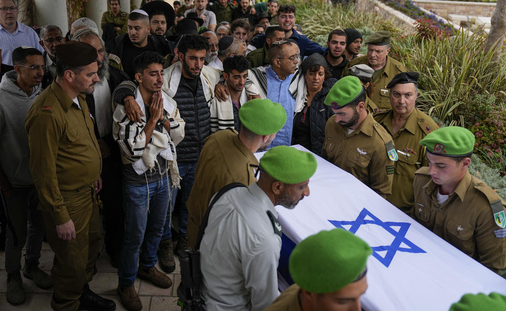 Israeli soldiers carry the coffin of Sgt. Lavi Ghasi, 19, at his funeral in Modiin, Israel, on Dec. 21.
