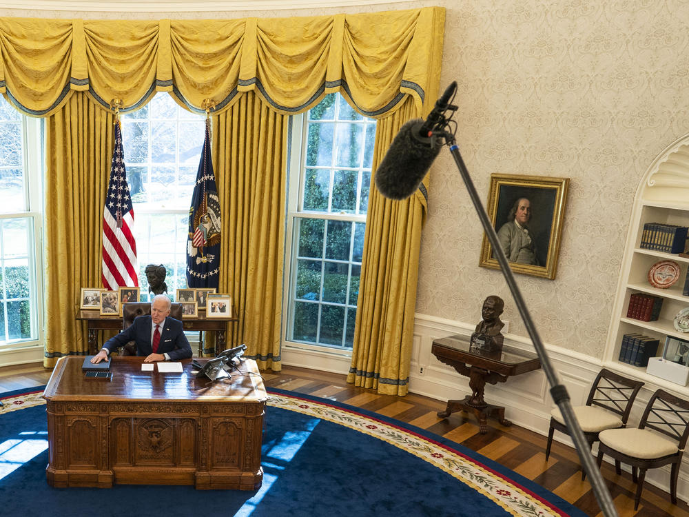 U.S. President Joe Biden is seen in the White House Oval Office of in January 2021 in Washington, D.C., as Vice President Kamala Harris looks on.