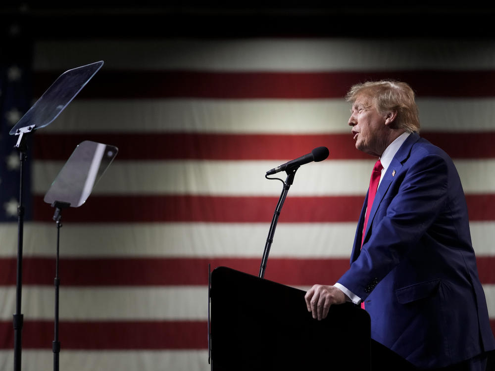 Former President Donald Trump speaks during a rally Sunday, Dec. 17, 2023, in Reno, Nev. In a brief filed Saturday, Trump asked a federal appeals court to dismiss an election interference case against him, arguing he's immune from prosecution.