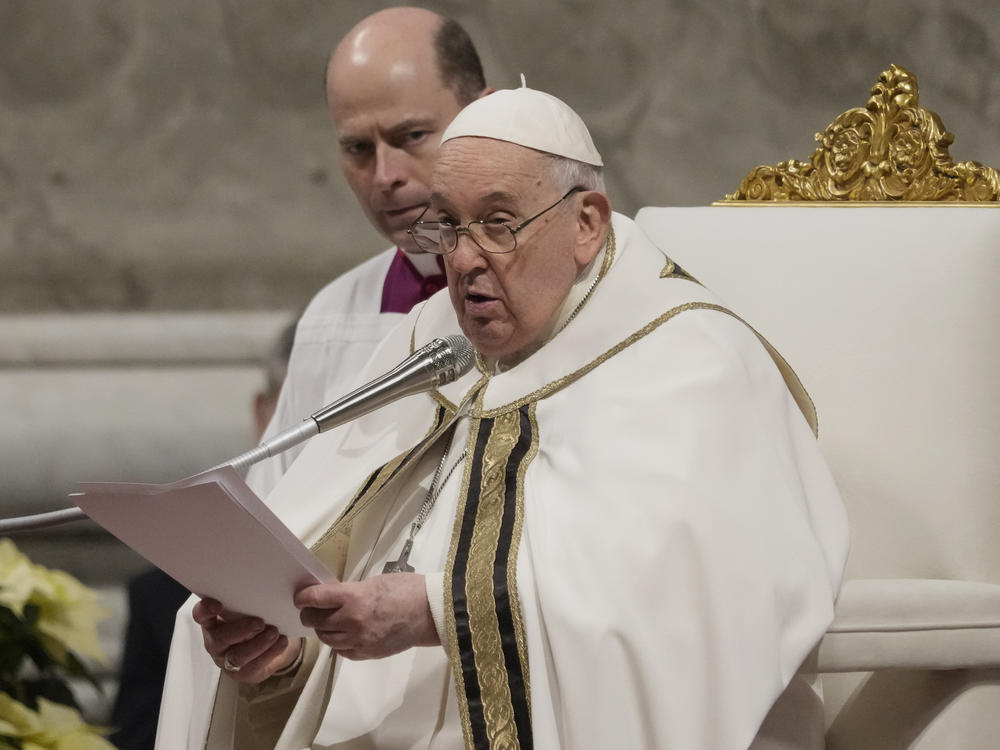 Pope Francis presides over Christmas eve Mass, at St. Peter's Basilica at the Vatican, on Sunday.