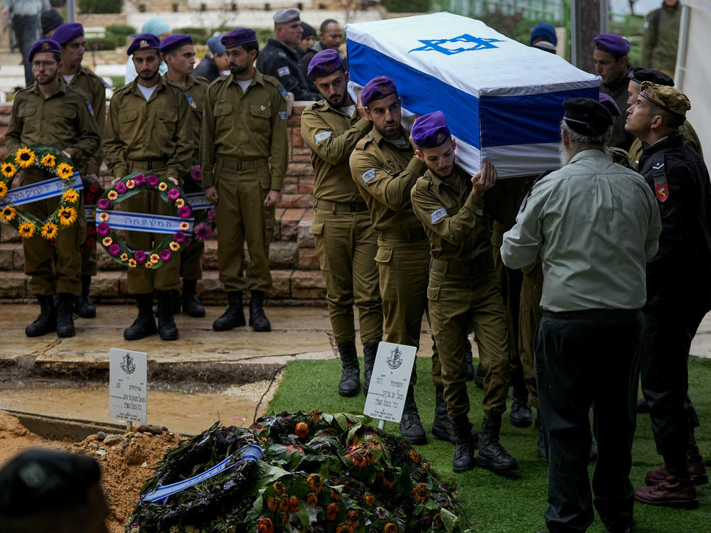 Israeli soldiers carry the flag-draped casket of Staff Sgt. Birhanu Kassie during his funeral at Mt. Herzl military cemetery in Jerusalem on Sunday.