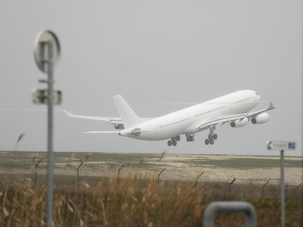 The plane grounded by police at the Vatry airport takes off Monday, Dec. 25, 2023 in Vatry, eastern France.