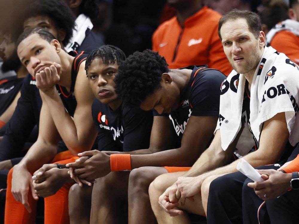 Detroit Pistons forward Kevin Knox II (from left) guard Marcus Sasser, forward Ausar Thompson and forward Bojan Bogdanovic sit on the bench during the fourth quarter of a 118-112 loss to the Brooklyn Nets on Tuesday in Detroit.