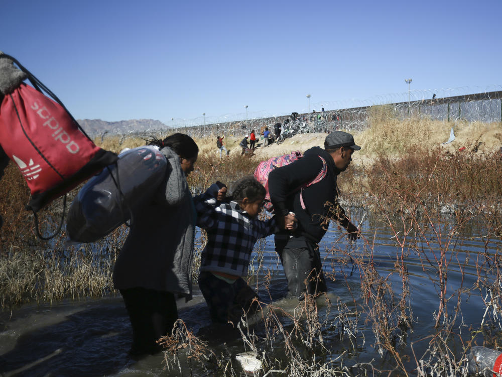 Migrants cross the Rio Grande river to reach the United States from Ciudad Juarez, Mexico, on Wednesday, Dec. 27, 2023.
