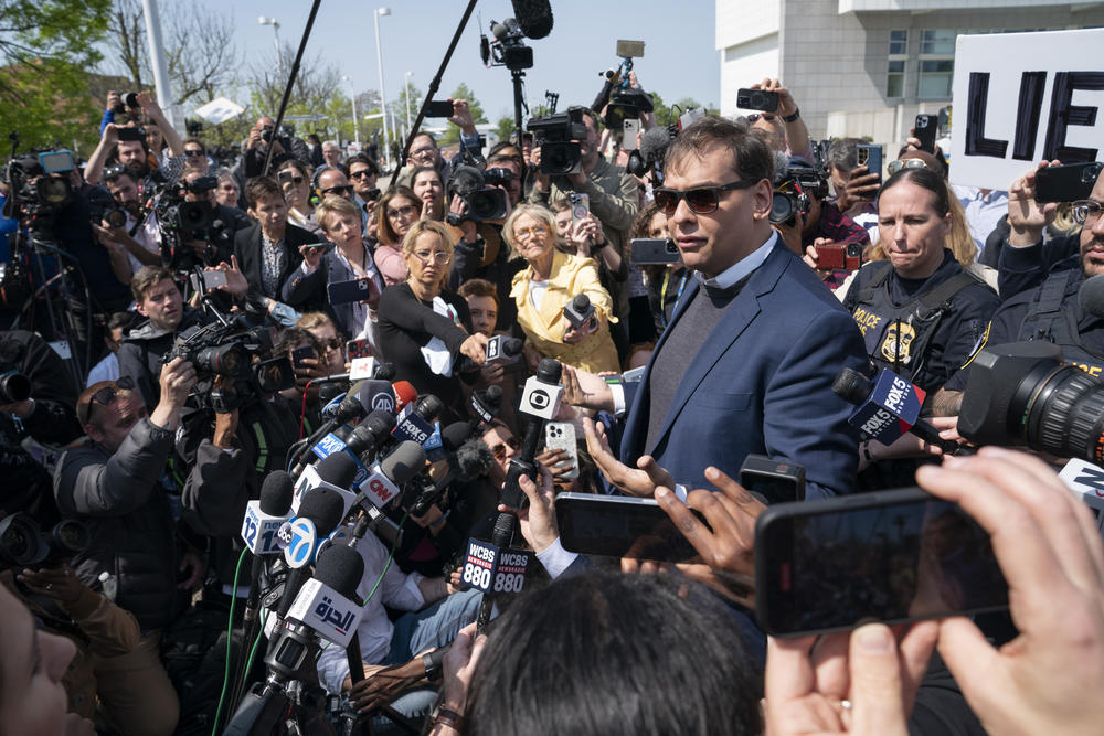 Rep. George Santos, R-N.Y., speaks to reporters as he leaves the federal courthouse in Central Islip, N.Y., on May 10. The House Ethics panel in November issued a scathing report that accused Santos of committing a wide array of crimes, including that he spent campaign cash on personal items like luxury purchases and Botox treatments.