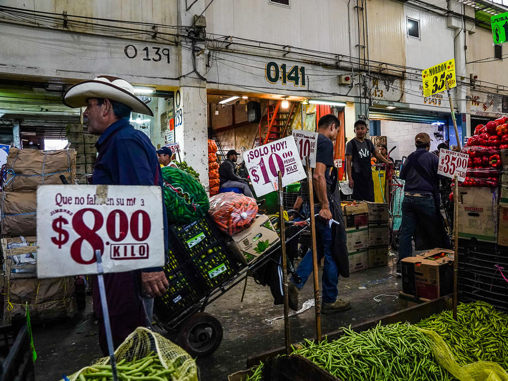 Every day, 19,000 workers ferry produce around the Central de Abastos on dollies and wheelbarrows.