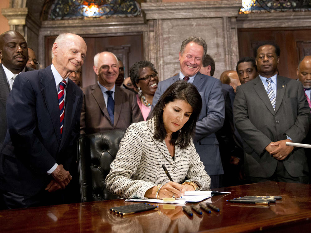 In this July 9, 2015 file photo, South Carolina Gov. Nikki Haley signed a bill into law that enabled the removal of the Confederate flag from the Statehouse grounds more than 50 years after the rebel banner was raised to protest the civil rights movement.