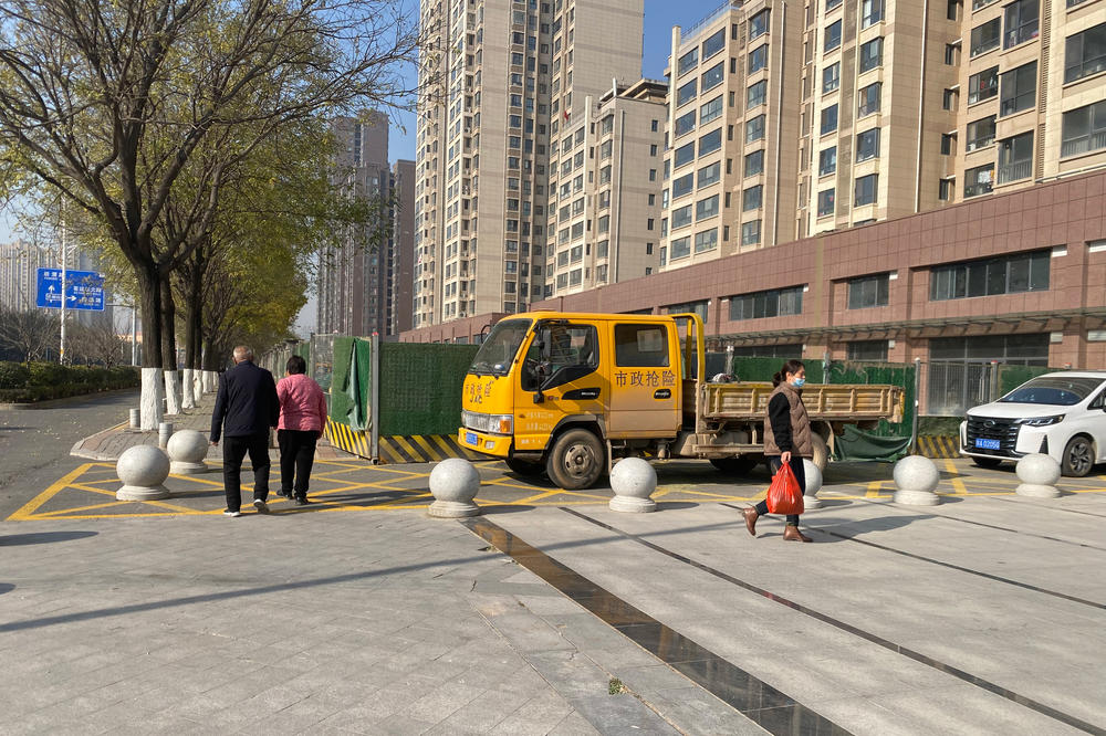 Outside the apartment complex where Lee Shin and his wife finally moved in after years of delay. Not long after Lee bought the unfinished apartment, construction stopped when the property developer allegedly lost money in other investments.