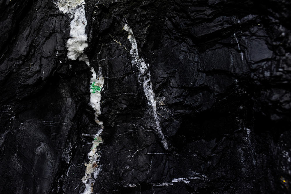 MUZO, COLOMBIA — Emeralds encrusted in white calcite rock inside the mine at Muzo in central Colombia. They will later be analyzed at a laboratory to determine their worth. <a href=