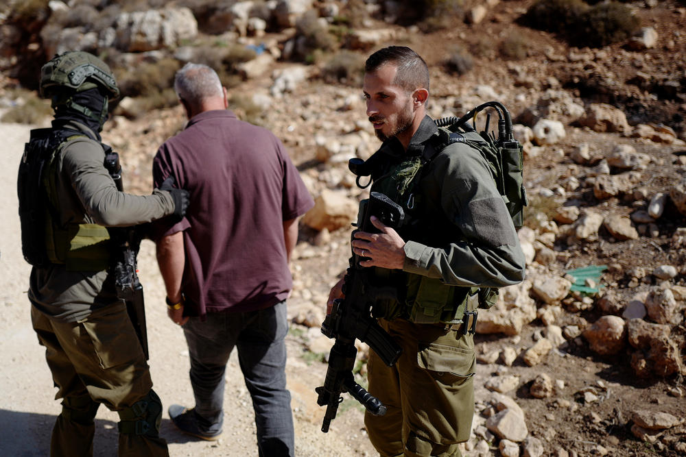 WEST BANK — Israeli forces take Ayoub Abuhejleh while he was being interviewed by NPR in the West Bank on Nov. 6, 2023. <a href=