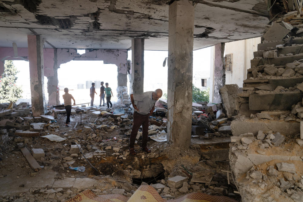 JENIN, WEST BANK - People walk through the ruins of Al-Ansar mosque in Jenin Refugee camp that was struck by Israeli military in retaliaition to the Hamas attack.<a href=