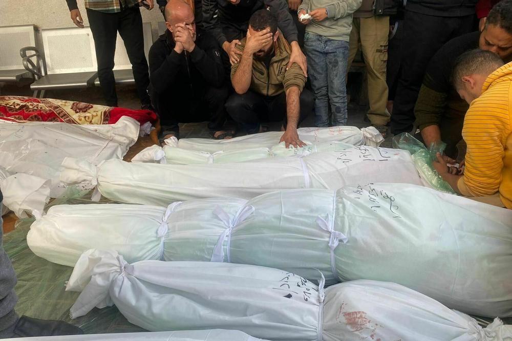 RAFAH, GAZA STRIP — At Mohammed Yousef al-Najjar Hospital, Palestinians mourn children and relatives from four different families killed as Israel resumed its bombing after a week-long cease-fire.