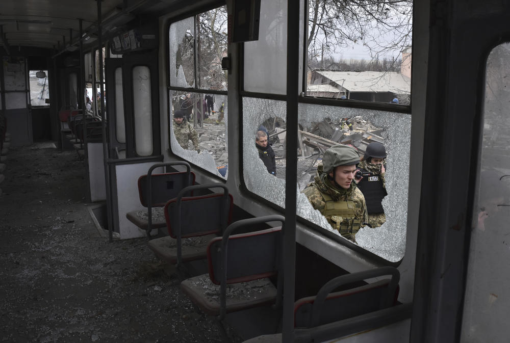 Zaporizhzhia: Servicemen are seen through the broken windows of a city tram, damaged in Russia's massive air attack.