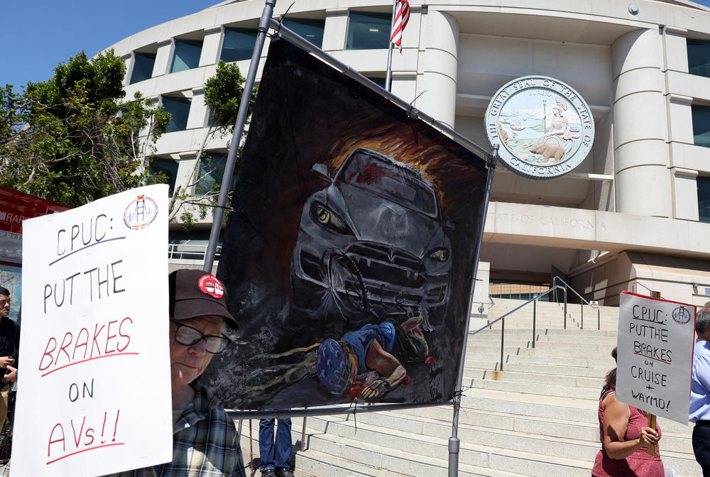Protesters demonstrate against driverless cars in front of the California Public Utilities Commission (CPUC) in San Francisco in August.