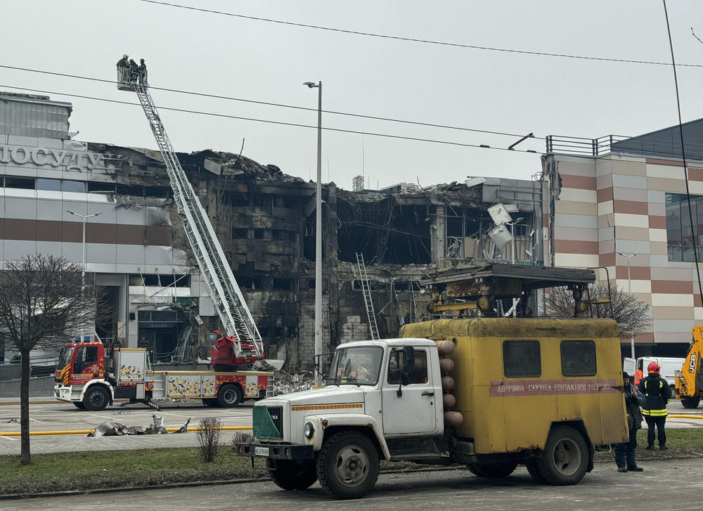 Dnipro: Firefighters and municipal employees work at the site after a rocket attack.