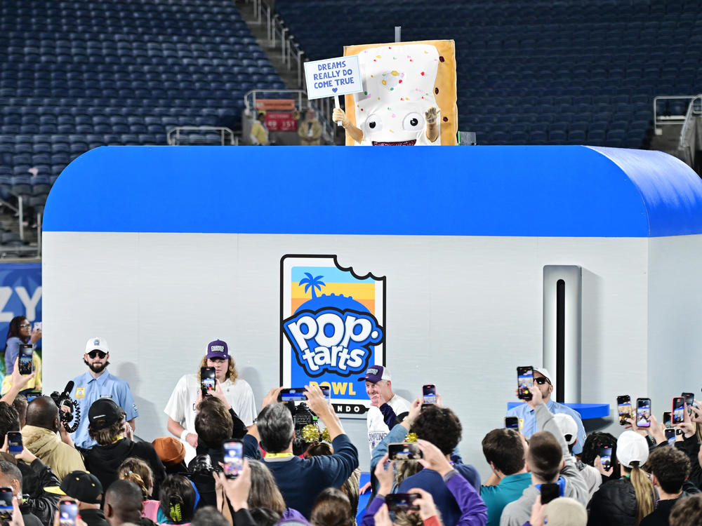 The Pop-Tarts mascot is lowered into a toaster following the 2023 Pop-Tarts Bowl between the Kansas State Wildcats and the NC State Wolfpack at Camping World Stadium on Thursday in Orlando, Fla.