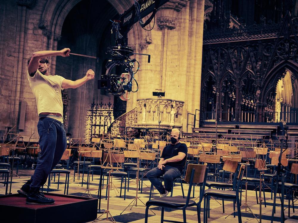 Cooper and Nézet-Séguin on the set of <em>Maestro</em>.