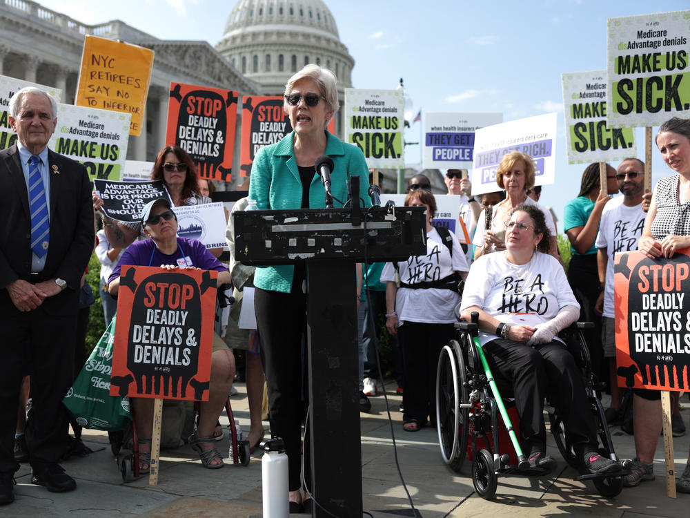 Sen. Elizabeth Warren, D.-Mass., speaks at a protest on Capitol Hill in July about the denials and delays for care in Medicare Advantage plans.