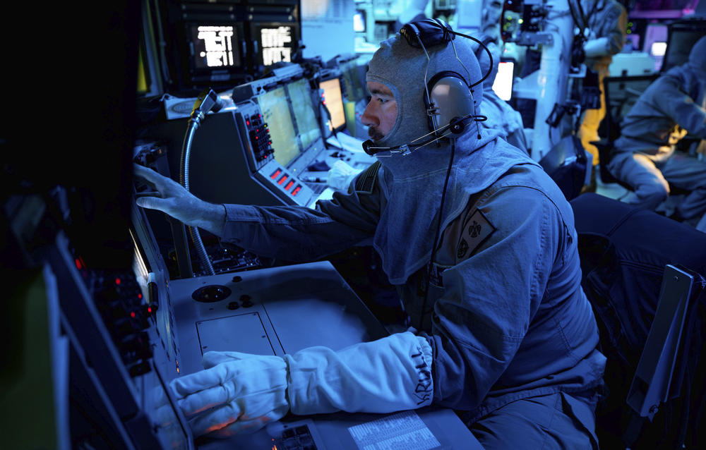 Chief Fire Controlman Kenneth Krull works at the combat information center on the USS Carney in the eastern Mediterranean in October. The ship was involved in shooting down a drone launched from Yemen in November. Houthi militants in Yemen have been firing on commercial ships the past two months. The photo was provided by the U.S. Navy.