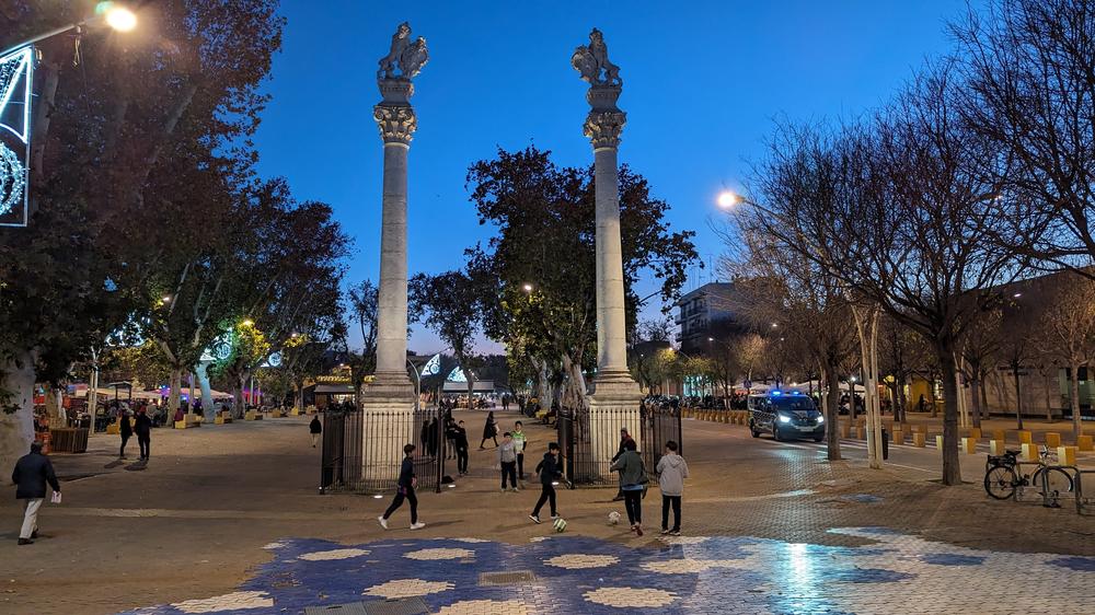 Children play soccer in the Alameda de Hércules, in the historic center of Seville.