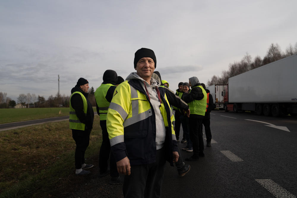 Truck driver Oleksandr Nekrasov, who is originally from Lutsk in western Ukraine, waits near his truck at the Dorohusk border in Poland. He has been stuck at the border for nearly two weeks.