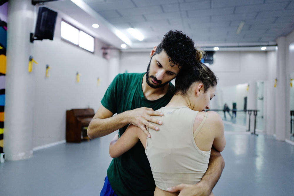 Hanna Tams (left) leads a dance class in his studio in East Jerusalem. Since Oct. 7, Tams says that he's been able to use dance to express himself amidst the oppression he feels as a Palestinian in Jerusalem. 'It's not easy,