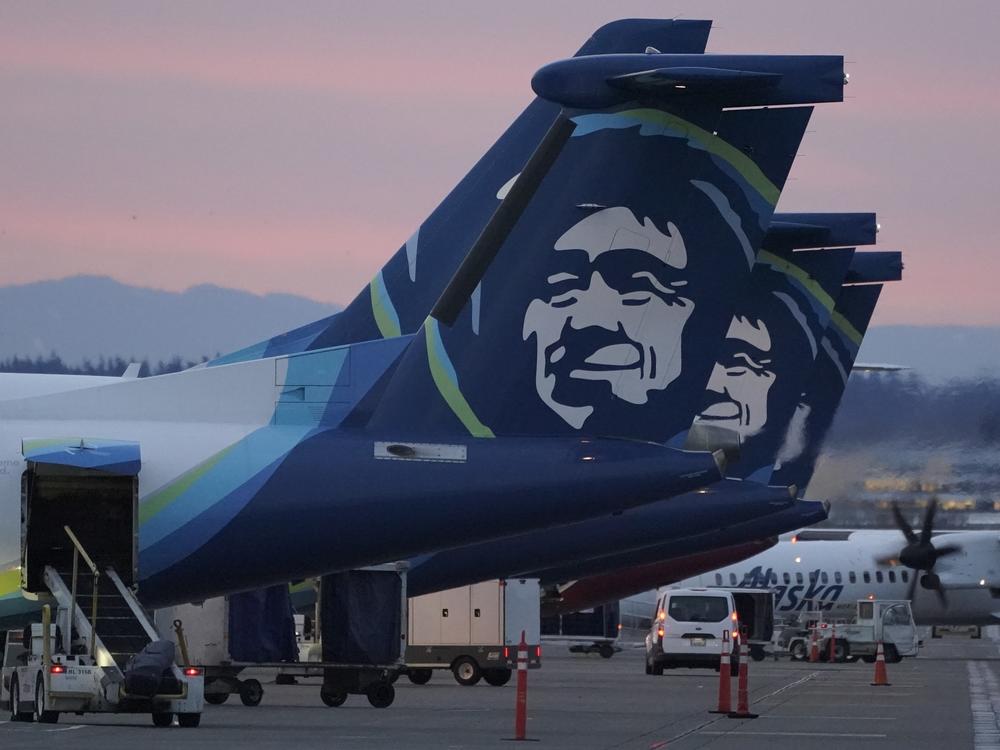Alaska Airlines planes are shown parked at gates at sunrise, March 1, 2021, at Seattle-Tacoma International Airport in Seattle.