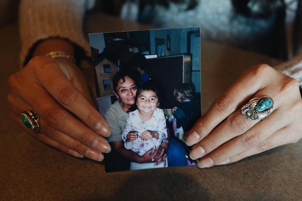 Ashley Edison holds up a family photo of her with her grandmother, Alta. Following in her grandmother's lead, Ashley also registers people to vote in Arizona.