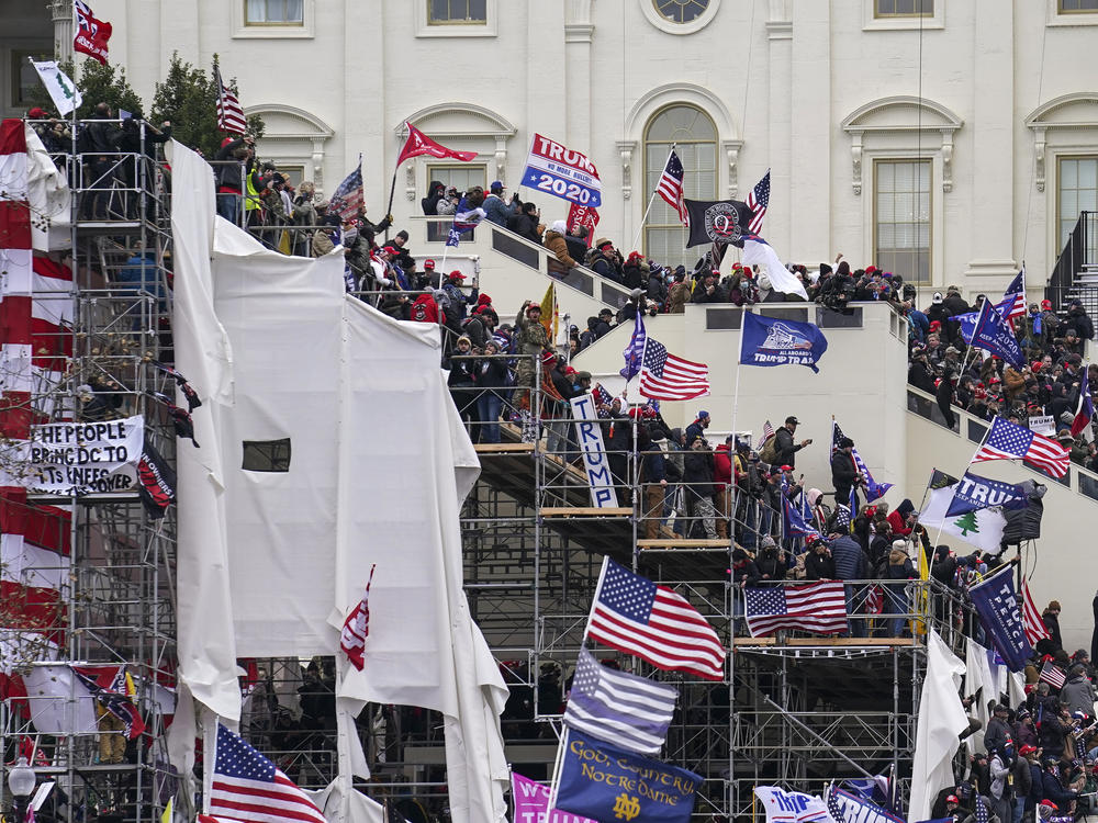 FILE - In this Jan. 6, 2021 file photo insurrectionists loyal to President Donald Trump riot outside the Capitol in Washington.