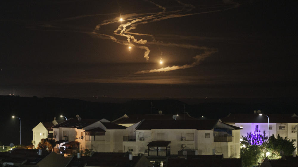 Flares rise over the Gaza Strip as seen from southern Israel on Monday.