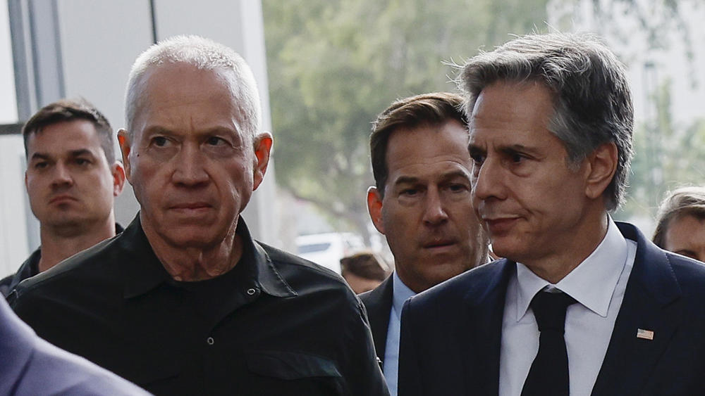 U.S. Secretary of State Antony Blinken and Israeli Cabinet Minister Benny Gantz, left, walk as they meet during his week-long trip aimed at calming tensions across the Middle East in Tel Aviv, Israel,  on Tuesday.