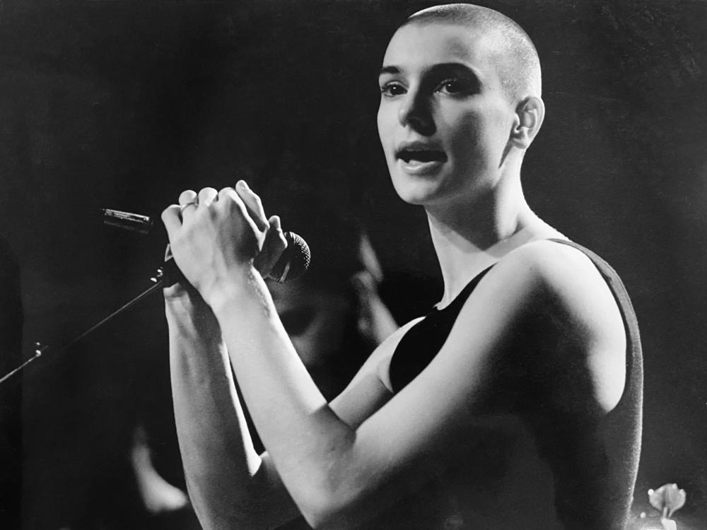 Sinéad O'Connor died of natural causes according to a coroner's statement. She's pictured above performing in Vancouver, Canada in the late 1980s.