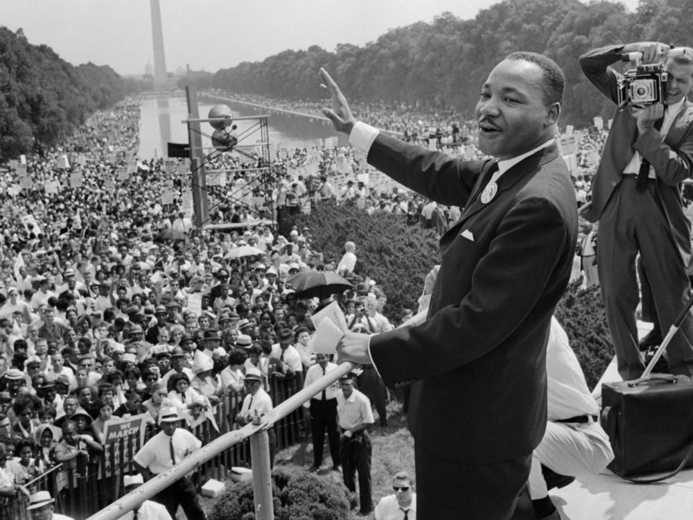 Martin Luther King Jr. stands in front of a crowd in Washington, D.C.