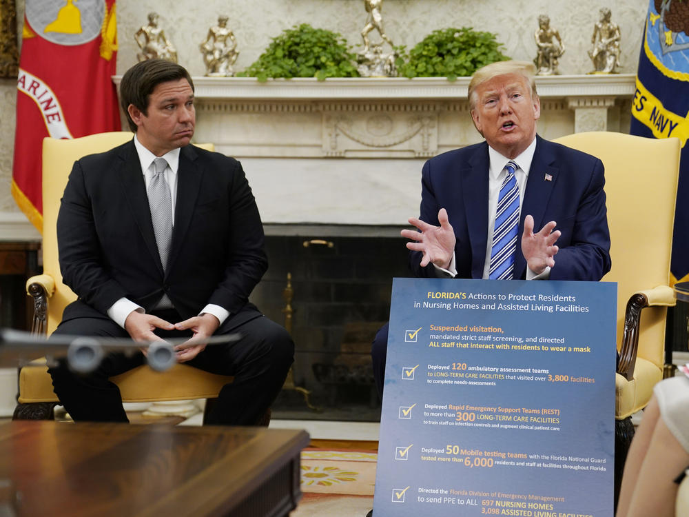 In this file photo from 2020, President Donald Trump speaks during a meeting with Gov. Ron DeSantis, R-Fla., in the Oval Office of the White House on April 28, 2020.