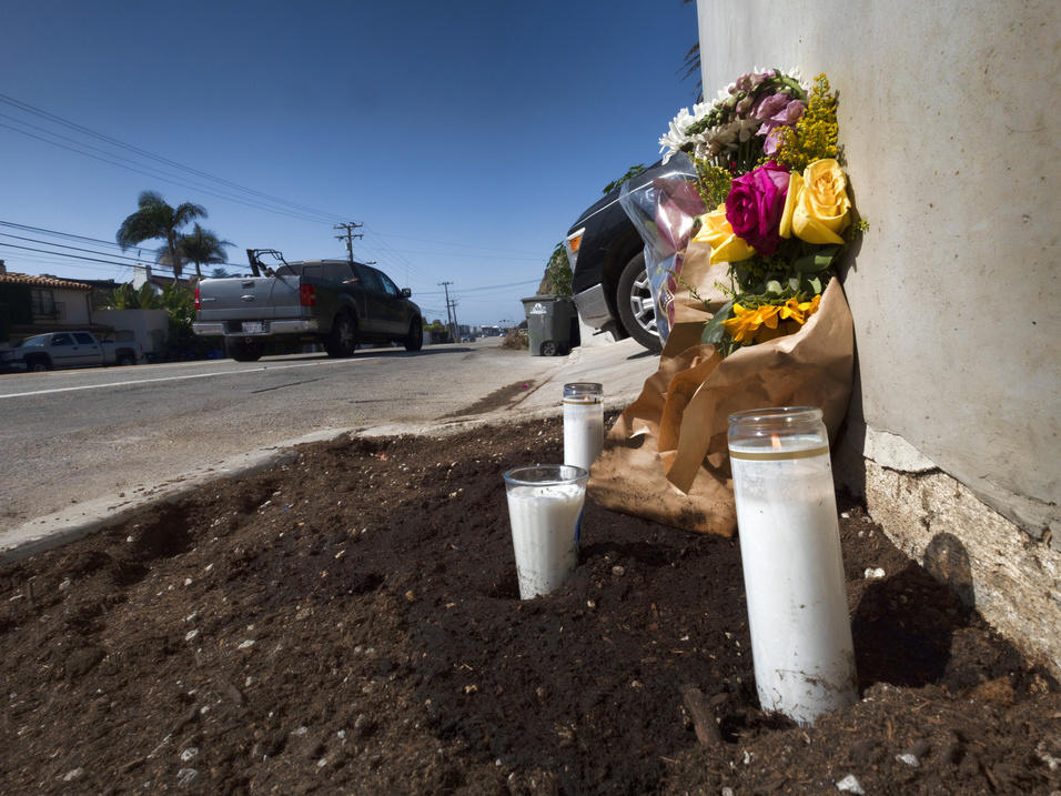 Candles and flowers on the side of the Pacific Coast Highway in Malibu, Calif., after a crash killed four college students in October 2023.
