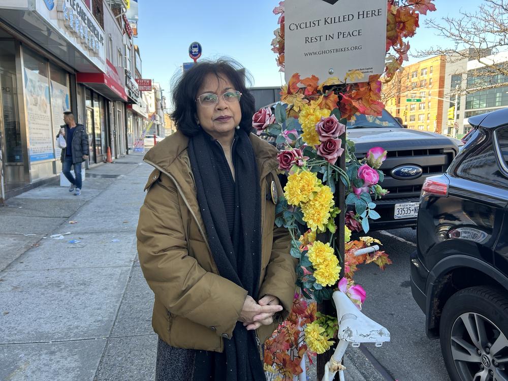 Lizi Rahman puts silk flowers on the white-painted 