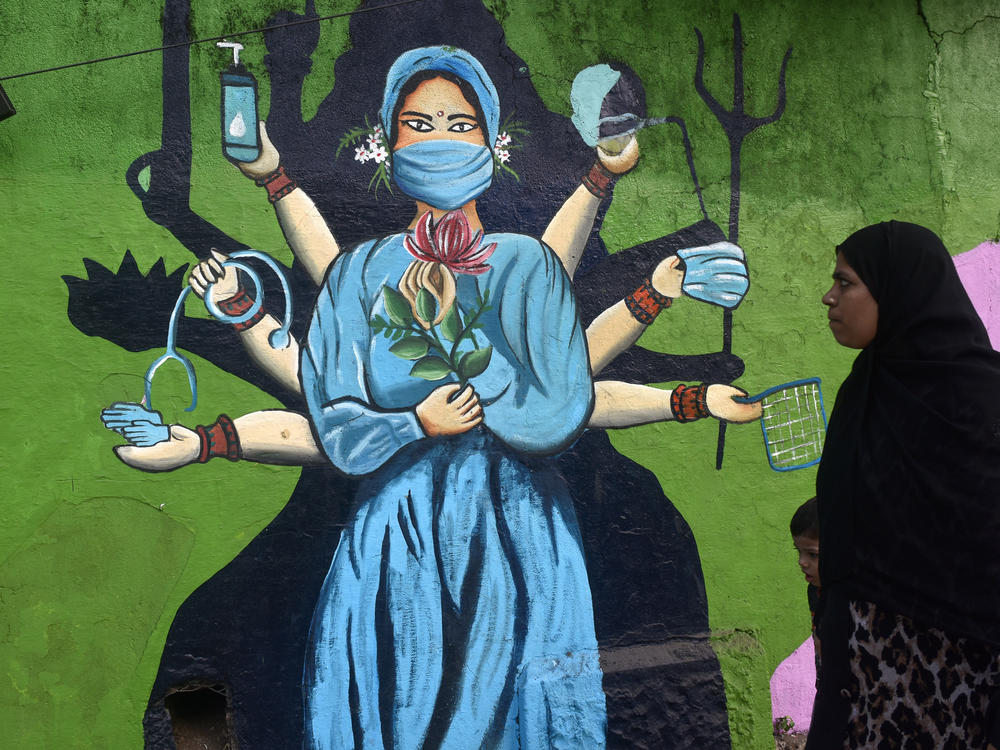 A street painting in Mumbai, India, reinforces the importance of masks amid a surge of COVID. The photo was taken on January 11.