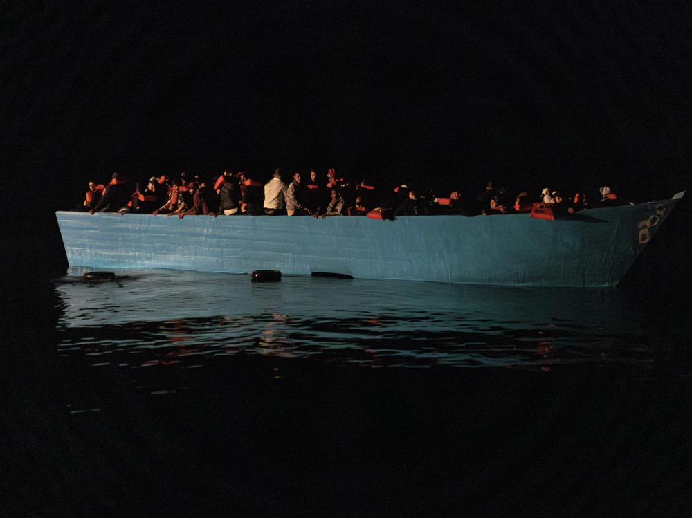 A wooden boat was spotted at night in international waters north of Libya by Doctors Without Borders' rescue team aboard the MV Geo Barents.