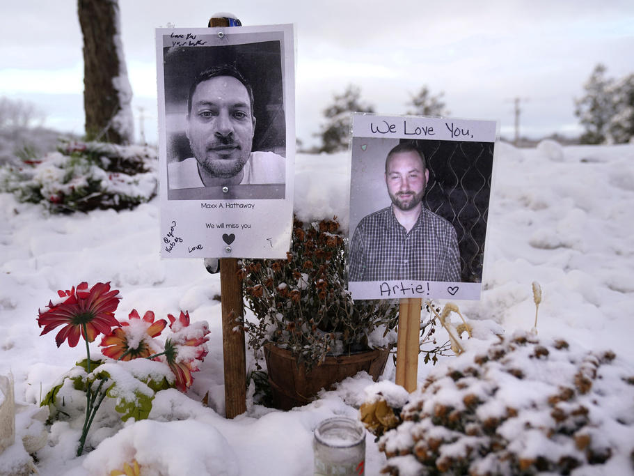 Pictures of two of the victims of the October 2023 mass shooting by Army reservist Robert Card are seen Dec. 5 at a makeshift memorial in Lewiston, Maine.