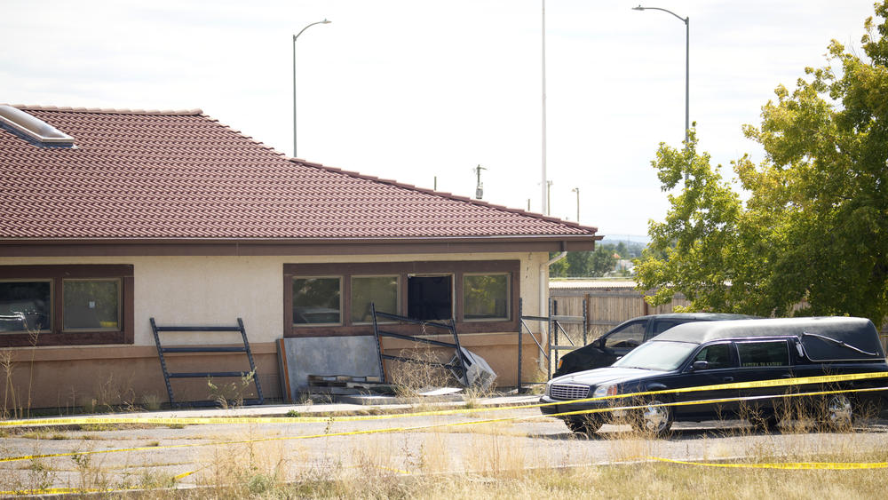 A hearse and van sit outside the Return to Nature Funeral Home in October.